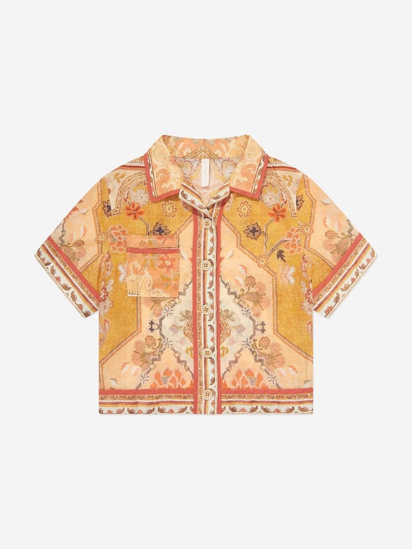 Australian label Zimmermann redefine the strategy of fashion by exploring their own identity that is neither trend-driven nor futuristic. This girls Wylie pocket shirt is woven in beautiful lightweight cotton in orange, beige and yellow shades, with a refined vintage style print. Soft and semi-sheer, it has a Cuban collar, a chest pocket, and button fastenings. 100 Cotton