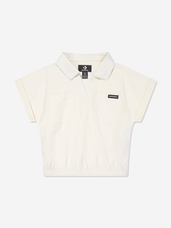 Converse combine 70s nostalgia with new innovative properties. This girls egret blouse is reflective of the American label's preference for authentic streetwear via a reconceptualised utilitarian outlook. Crafted with a collar in a V-neck style showcasing brand embroidery, two front pockets, an elasticated waistband and a folded brim on short sleeves. 60 Cotton, 40 Rayon