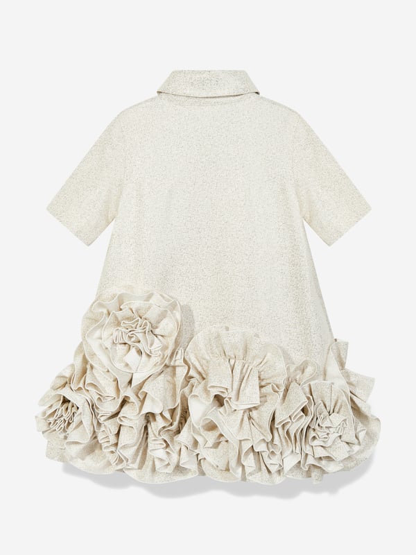 Jessie and James embody timeless elegance and modern charm. This girls dream on frilly flower dress is reflective of the label's distinctive care and craftsmanship. It has exaggerated ruffles at the bottom hem with a classic shirt collar. Radiates an opulent, shimmering finish. Excusive to Childsplay Short Sleeves 59 Polyester, 28 Polyamide, 13 Metallic Fibre