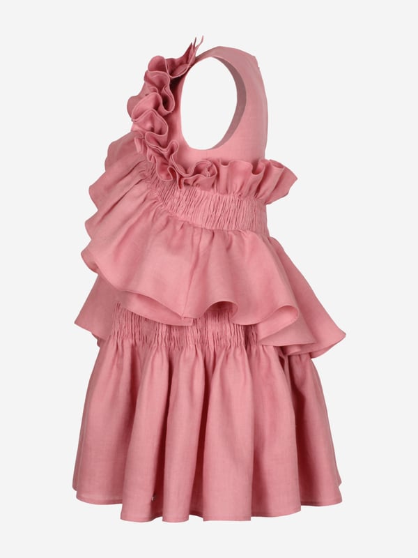 Introducing the exquisite Girls Wreath Linen Ruffle Dress in Pink by Jessie and James, a quintessential piece for SS2025. Each detail is meticulously crafted to ensure your little girl shines at every summer soirée. Luxurious Linen Crafted with the finest linen, ensuring breathability and comfort. Delicate Ruffles Elegant ruffles enhance the dress's charm, perfect for any celebration. Vibrant Pink Hue A captivating pink that exudes style and femininity.Elevate her wardrobe with this timeless garment from Jessie and James. Order now!