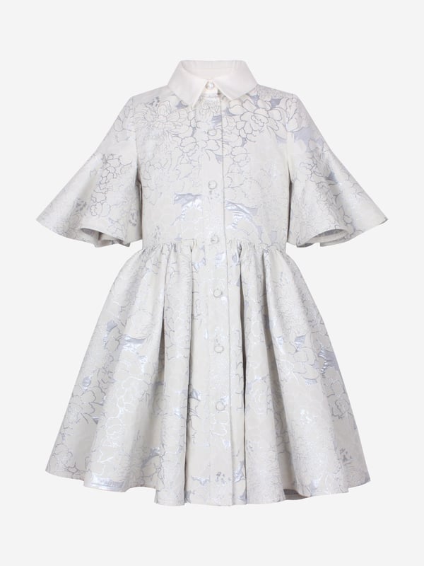 Jessie and James embody timeless elegance and modern charm. Crafted with a sophisticated jacquard floral print, this girls little sister blue clouds jacquard dress combines classic style with contemporary flair. Woven in ice blue. It showcases a front button fastening, classic collar, flared cuffs, and an elegant peplum hem. Outer Polyester 50, Cotton 39, Metallic Fibre 11 Lining Cotton 100