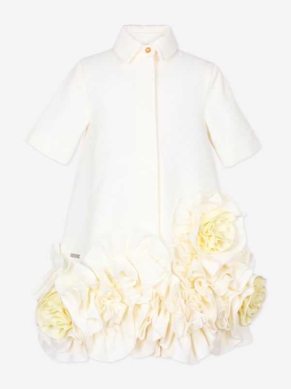 Introducing the Girls Dream On Frilly Flower Dress in Ivory, a quintessential addition to your little lady's wardrobe from the esteemed designers at Jessie and James for SS2025. Heres why its simply unmissable Exquisite Ivory Palette A sophisticated, soft ivory hue enhances its charming elegance. Delicate Frills Layered frills add a flourish of grace and movement. Premium Fabrication Crafted with superior fabrics for outstanding comfort and durability. Fashion a memorable season choose Jessie and James. Shop now!