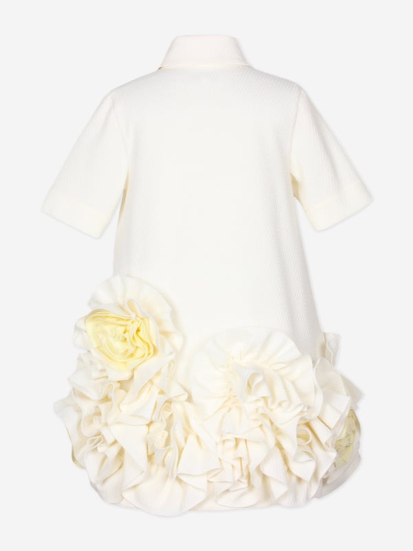 Introducing the Girls Dream On Frilly Flower Dress in Ivory, a quintessential addition to your little lady's wardrobe from the esteemed designers at Jessie and James for SS2025. Heres why its simply unmissable Exquisite Ivory Palette A sophisticated, soft ivory hue enhances its charming elegance. Delicate Frills Layered frills add a flourish of grace and movement. Premium Fabrication Crafted with superior fabrics for outstanding comfort and durability. Fashion a memorable season choose Jessie and James. Shop now!