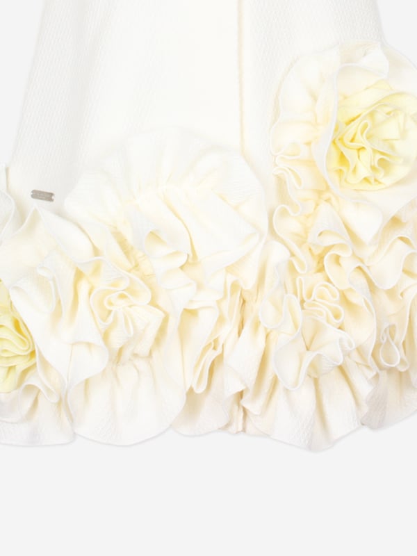 Introducing the Girls Dream On Frilly Flower Dress in Ivory, a quintessential addition to your little lady's wardrobe from the esteemed designers at Jessie and James for SS2025. Heres why its simply unmissable Exquisite Ivory Palette A sophisticated, soft ivory hue enhances its charming elegance. Delicate Frills Layered frills add a flourish of grace and movement. Premium Fabrication Crafted with superior fabrics for outstanding comfort and durability. Fashion a memorable season choose Jessie and James. Shop now!