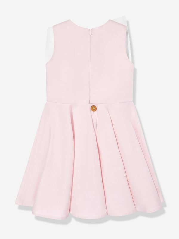 Introducing the exquisite Girls Peony Flower Dress in Pink by Jessie and James, a quintessential addition for SS2025, designed to enchant and delight. Elegant Design Crafted with a delicate peony print, exuding timeless grace and femininity. Luxurious Fabric Tailored from premium fabric, ensuring both comfort and durability for any occasion. Vibrant Pink Hue A charming, rich pink shade that captures the essence of spring and fashion-forward allure.Enrich your little girl's wardrobe with this splendid piece from Jessie and James. Secure the season's must-have now!