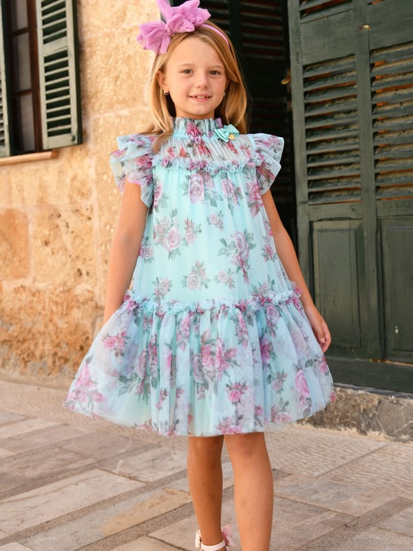 Introducing the exquisite Girls Marigold Roses Dress in Blue by Angels Face, an essential addition to your little girl's SS2025 wardrobe. Luxuriously crafted and wonderfully versatile, this dress promises style and comfort. Key highlights include Elegant Design Featuring a captivating blue tone enriched with marigold rose prints for a chic flourish. Premium Fabric Constructed with fine materials, ensuring both durability and delicacy on your child's skin. Perfect Fit Tailored to combine grace and ease, ensuring your girl moves freely while looking her best.Enhance her collection with this stunning piece from Angels Face. A harmonious blend of fashion and function, destined to be cherished.
