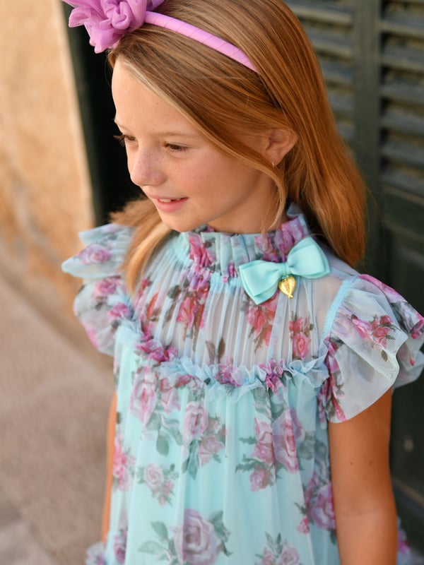 Introducing the exquisite Girls Marigold Roses Dress in Blue by Angels Face, an essential addition to your little girl's SS2025 wardrobe. Luxuriously crafted and wonderfully versatile, this dress promises style and comfort. Key highlights include Elegant Design Featuring a captivating blue tone enriched with marigold rose prints for a chic flourish. Premium Fabric Constructed with fine materials, ensuring both durability and delicacy on your child's skin. Perfect Fit Tailored to combine grace and ease, ensuring your girl moves freely while looking her best.Enhance her collection with this stunning piece from Angels Face. A harmonious blend of fashion and function, destined to be cherished.