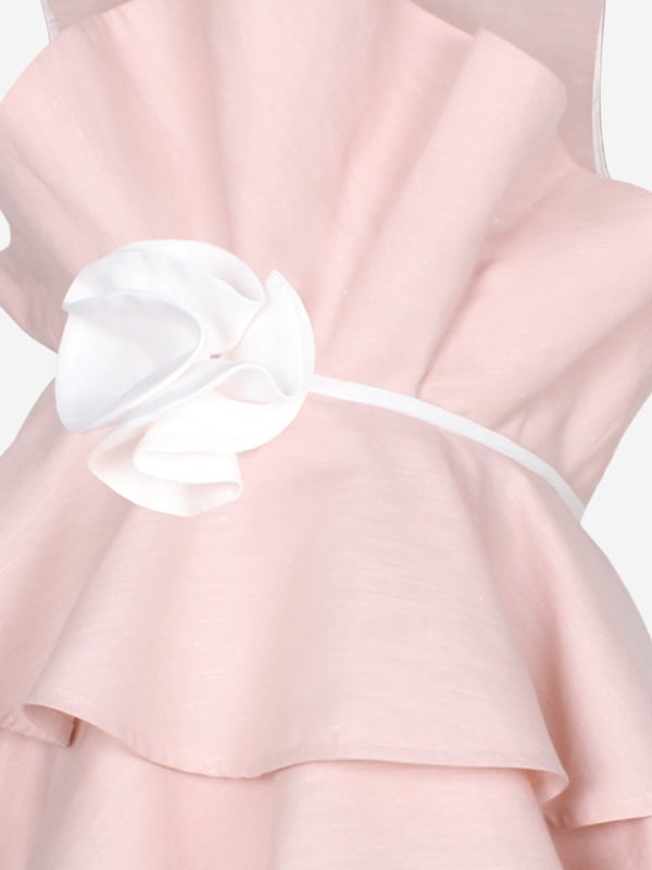 Jessie and James incorporate passion and timeless elegance into their beautiful aesthetics. This girls soft pink Ebony occasion dress is reflective of the label's intricate craftsmanship and precision of beauty. Features delicate ruffles on the bodice and skirt. There is a white waistband to provide definition, with an elegant floral appliqué on one side. Round Neck Layered Effect Sleeveless 55 Cotton 45 Hemp