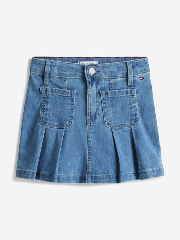 Tommy Hilfiger Girls Pleated Denim Skirt in Blue Introducing the Tommy Hilfiger Girls Pleated Denim Skirt in Blue an essential addition for SS2025. Crafted with flair, this skirt encapsulates both comfort and fashion for your young one. Key features include Classic Pleated Design Chic pleats merge timeless style with a fresh, youthful twist. Vibrant Blue Hue A striking blue shade complements any top, ensuring versatility across seasons. Quality Denim Fabrication Durably constructed to withstand the joys of childhood. Signature Branding Embellished with the iconic Tommy Hilfiger logo for an exquisite touch.Revitalize your girl's wardrobe with this delightful, versatile piece.