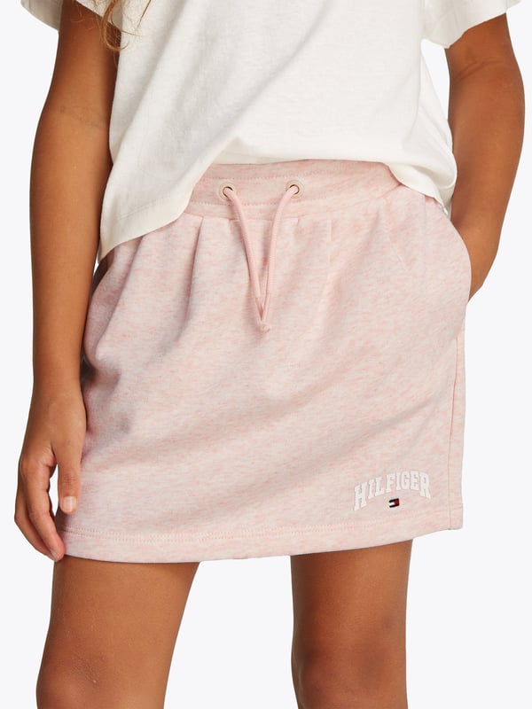 Introducing the Tommy Hilfiger Girls Terry Skirt in Pink, a stunning essential for SS2025. This skirt exudes charm and sophistication, perfect for the modern young lady. Key features include Exquisite Pink Hue Radiates a gentle yet vibrant charm, ideally capturing the playful spirit of youth. Luxurious Terry Fabric Offers both supreme comfort and durability, ensuring it's perfect for both play and special occasions. Signature Tommy Hilfiger Style Embellished with the iconic branding, it's a true testament to timeless fashion.Elevate your girl's wardrobe with this chic and stylish piece.