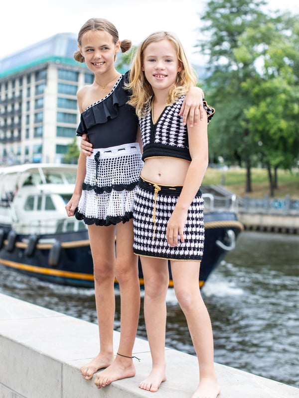 Introducing the Girls Noyao Skirt in Black by nessi byrd, an essential addition to your girl's SS2025 wardrobe. Crafted with exquisite care, this skirt is the epitome of high-end fashion for the modern young lady. Here's why it's a must-have Elegantly Tailored Precision-cut for a chic, polished look. Premium Fabric Luxuriously soft, ensuring all-day comfort. Versatile Style Perfect for parties or playgrounds.Upgrade her ensemble with the timeless sophistication of the Noyao Skirt.