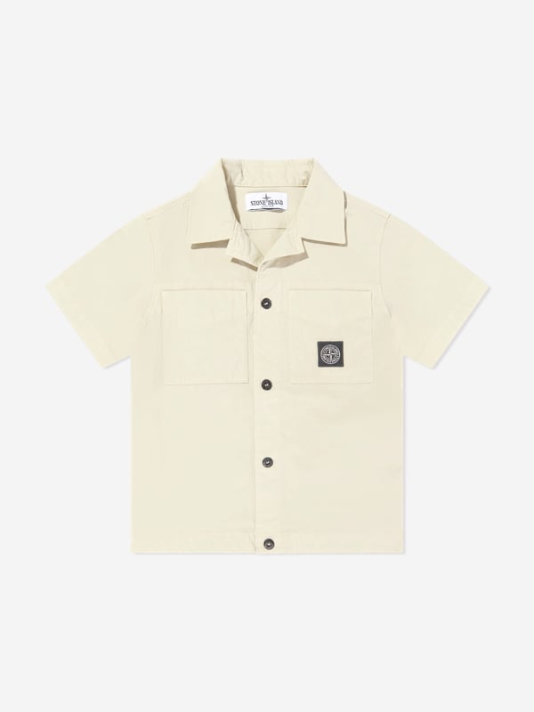 Introducing the epitome of Italian craftsmanship, the Boys Logo Pocket Shirt in Beige by Stone Island Junior. Perfect for the discerning young gentleman's SS2025 wardrobe, this shirt seamlessly blends sophistication with playful charm. Exquisite Italian Craftsmanship Meticulously made in Italy, promising unparalleled quality and durability. Subtle Logo Detailing Features Stone Island's signature compass logo, tastefully positioned to elevate look. Tailored for Comfort Constructed from premium fabrics for all-day comfort and ease. Versatile Beige Hue A stylish, easy-to-pair colour ensuring endless outfit possibilities.Revamp your boy's style with this chic and timeless piece. Order now for a touch of luxury!
