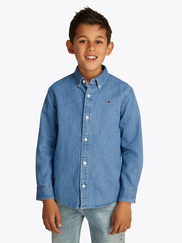 Step into timeless style with the Tommy Hilfiger Boys Denim Chambray Shirt in Blue, a sartorial staple for SS2025. Crafted from meticulously sourced fabric, this piece offers both comfort and classic charm. Its distinctive features include Exquisite Chambray Fabric Lightweight and breathable, ideal for playful days and serene evenings. Signature Tommy Detailing Elevate his look with iconic stitching and logos. Versatile Style Perfect for both casual and smart-casual occasions.Revitalize his wardrobe with this quintessential Tommy Hilfiger creation!