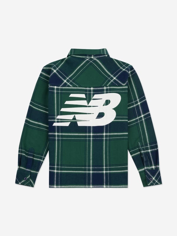 New Balance combine modern innovation with classic portraits. This boys long sleeve premium nightwatch shirt is a captivating construction. Made in a beautiful cotton check print, showcasing a classic collar, two chest patch pockets, and a logo patch at the chest. Front Button Fastening Buttoned Cuffs Embroidered Logo to the Rear Straight Hem Cotton 100