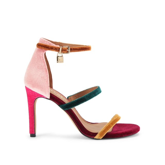 This Kurt Geiger Park Lane heel is crafted from a tonal pink velvet. The heel is enclosed with gold buckle on the ankle strap as well as small gold branded stud detail at the heel. Heel height: 9.5cm.