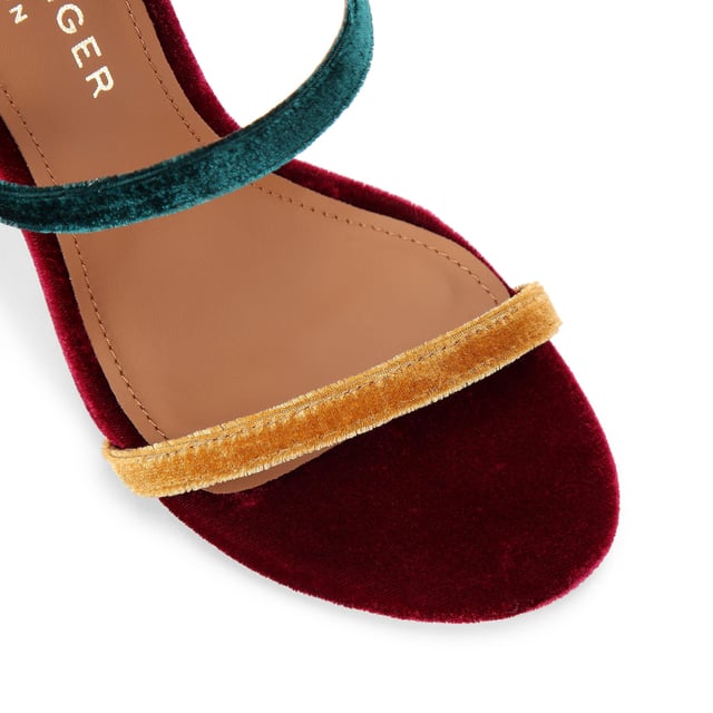 This Kurt Geiger Park Lane heel is crafted from a tonal pink velvet. The heel is enclosed with gold buckle on the ankle strap as well as small gold branded stud detail at the heel. Heel height: 9.5cm.