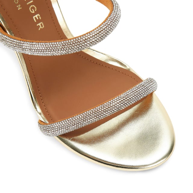 This Kurt Geiger Park Lane heel is crafted from a gold leather. The heel is enclosed with gold buckle on the ankle strap as well as small gold branded stud detail at the heel. Heel height: 9.5cm.