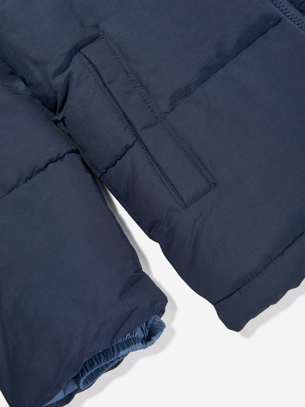 New Balance depict American apparel into timeless sophisticated wear. This boys NB navy puffer jacket is engineered in beautiful heavy padding and a nylon lining for extra warmth. Perfect for the cooler season. 64 Cotton, 36 Nylon