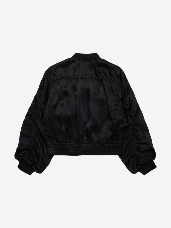 Discover the exquisite Girls Shiny Bomber Jacket in Black by Diesel a quintessential addition to any young lady's wardrobe for SS2025. Crafted with meticulous attention to detail, this piece blends timeless elegance with a contemporary edge. Here are its standout features Luxurious Gloss Finish Elevates the classic bomber with a high-shine allure, perfect for stylish festivities. Lightweight Durability Fashioned from premium materials to endure the thrills of childhood while maintaining chic. Signature Diesel Panache Emblems of the esteemed brand add an exclusive touch of class.Refresh your girl's ensemble with this distinctive jacket. Secure yours today and watch her shine with confidence!