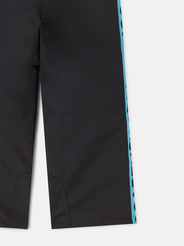 Stella McCartney Kids Logo Ski Trousers in Black Dress your little adventurers in Stella McCartneys Kids Logo Ski Trousers in Black for AW2024. Expertly crafted to combine elegance with practicality, these trousers are essential for those brisk winter escapades. Key features include Insulative Fabric Specifically designed to retain warmth while ensuring breathability during active play. Durable Reinforcements Reinforced seams and robust materials withstand the rigours of child's play, ensuring longevity. Adjustable Fittings Elasticated waistband and adjustable straps offer a snug, comfortable fit, adapting to growing children.Upgrade your child's winter wardrobe with these stylish and practical ski trousersperfect for both boys and girls. Place your order today for standout seasonal style and performance!