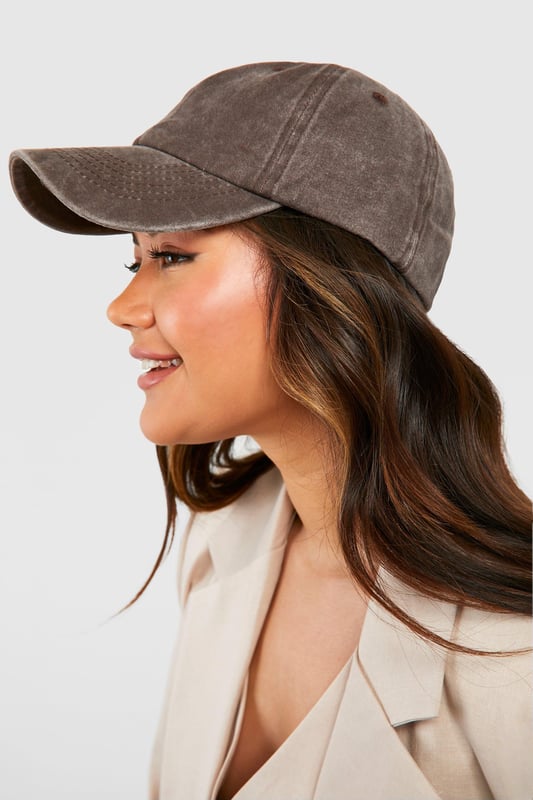 Classic baseball cap silhouette
        Soft, textured fabric for comfort
        Adjustable strap for a customised fit
        Curved brim for sun protection
        Versatile design suitable for various casual outfits
    
    This baseball cap is the perfect accessory to add a touch of laid-back cool to your everyday look. Its classic design makes it a versatile piece that can be styled with a multitude of casual outfits. Pair it with your favourite jeans and a crisp white tee for a timeless ensemble, or throw it on with a flowy sundress for a chic contrast. The cap is ideal for those relaxed weekend brunches, casual shopping trips, or lazy days in the park. Its practical design also makes it a great choice for outdoor activities or when you're running errands. The adjustable strap ensures a comfortable fit, while the curved brim offers protection from the sun. Whether you're aiming for an effortlessly stylish look or need a functional accessory for your day out, this baseball cap is your go-to choice for adding that final touch to your casual wardrobe.