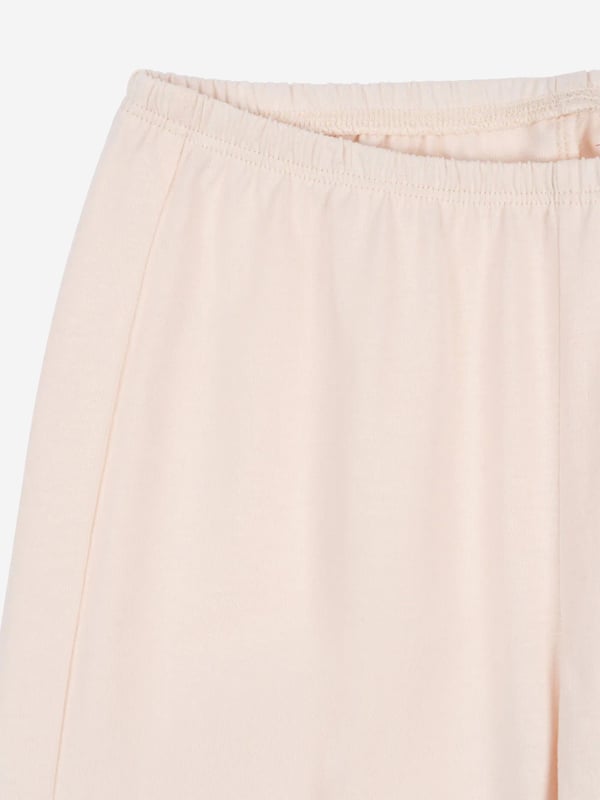 Konges Slojd's Scandinavian fashion is both alternative and eco-friendly conscious. This girls soft pink pyjama set is woven in beautiful organic cotton via a light pink base. It contains a long sleeve top with a pair of matching trousers. The top sports an adorable cartoon bunny on the front whilst the trousers come with an elasticated waistband to provide the utmost comfort. Side Slits Organic Cotton 100