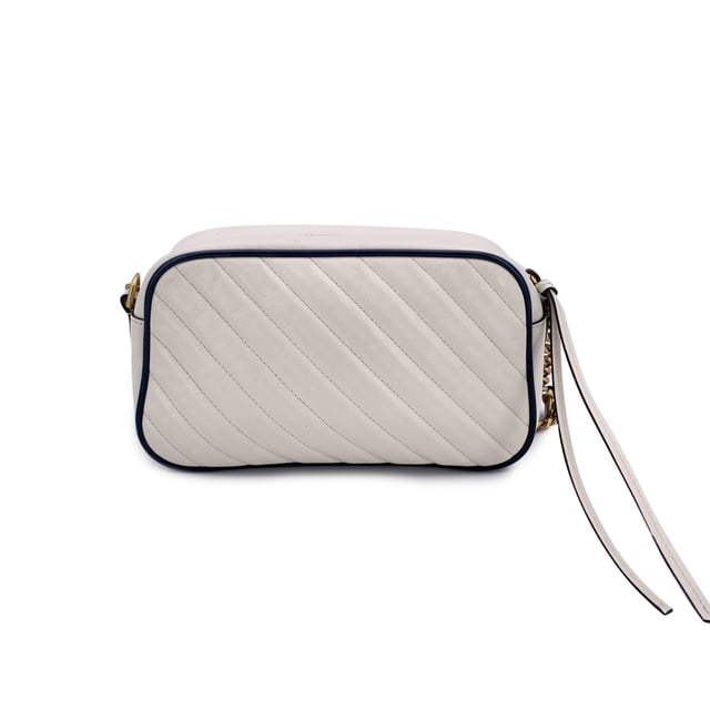 VINTAGE, RRP AS NEW
This beautiful Bag will come with a Certificate of ity provided by Entrupy. The certificate will be provided at no further cost.  Step into timeless elegance with this beautiful Gucci GG Marmont Small Zip Around Shoulder Bag, a true gem for lovers of vintage luxury. Crafted in soft white matelassé quilted leather, the bag is gracefully framed with navy blue leather trim-a nod to nautical chic that never goes out of style.  At the heart of its design, the iconic gold metal Torchon GG logo gleams proudly on the front, echoing Gucci's rich heritage. The bag zips open at the top to reveal a refined microfibre interior, complete with a convenient side pocket for your essentials.  The shoulder strap-an artful blend of adjustable navy leather and antique gold chain-lets you wear it crossbody or snug on the shoulder, adding versatility to its elegance. Inside, a discreet 'Gucci - Made in Italy' tag whispers top crftmanship, backed by a serial number hidden on its reverse.  A striking yet subtle piece, this GG Marmont model captures the spirit of classic Italian craftsmanship with a modern, collector-worthy twist.  Condition Rating: A - EXCELLENTCondition Details: Gently used. Minimal wear of use on leather trim. Minimal wear of use on the internal lining. Please check the photos carefully and ask if you need to know more details or if you have any doubts.Measurements (cm):Depth: 6.4Height: 12.7Length: 24.1Other Details: Dustbag? NoKeys? NoBox? No Measurments:  width: 64 mm length: 241 mm height: 127 mm strap length: 0 mm handle drop: 0 mm
