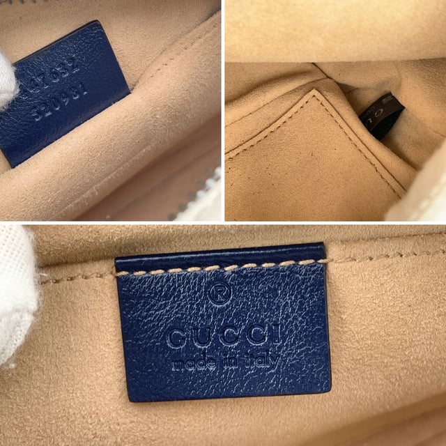 VINTAGE, RRP AS NEW
This beautiful Bag will come with a Certificate of ity provided by Entrupy. The certificate will be provided at no further cost.  Step into timeless elegance with this beautiful Gucci GG Marmont Small Zip Around Shoulder Bag, a true gem for lovers of vintage luxury. Crafted in soft white matelassé quilted leather, the bag is gracefully framed with navy blue leather trim-a nod to nautical chic that never goes out of style.  At the heart of its design, the iconic gold metal Torchon GG logo gleams proudly on the front, echoing Gucci's rich heritage. The bag zips open at the top to reveal a refined microfibre interior, complete with a convenient side pocket for your essentials.  The shoulder strap-an artful blend of adjustable navy leather and antique gold chain-lets you wear it crossbody or snug on the shoulder, adding versatility to its elegance. Inside, a discreet 'Gucci - Made in Italy' tag whispers top crftmanship, backed by a serial number hidden on its reverse.  A striking yet subtle piece, this GG Marmont model captures the spirit of classic Italian craftsmanship with a modern, collector-worthy twist.  Condition Rating: A - EXCELLENTCondition Details: Gently used. Minimal wear of use on leather trim. Minimal wear of use on the internal lining. Please check the photos carefully and ask if you need to know more details or if you have any doubts.Measurements (cm):Depth: 6.4Height: 12.7Length: 24.1Other Details: Dustbag? NoKeys? NoBox? No Measurments:  width: 64 mm length: 241 mm height: 127 mm strap length: 0 mm handle drop: 0 mm