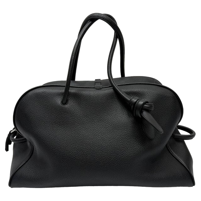 VINTAGE, RRP AS NEW
Travel in style with the Jacquemus Le Grand Turismo Holdall Weekend Bag, crafted in sleek black leather for a refined, minimalist aesthetic. Its structured silhouette, top handles, and subtle logo detailing make it both functional and fashion-forward. Pair it with a tailored coat, slim trousers, and leather sneakers for a polished weekend getaway look that speaks effortless sophistication.

 Jacquemus Le Grand Turismo Holdall Weekend Bag in Black Leather

Condition: Excellent
Signs of wear: No visible signs of wear
Packaging: None
Color: Black
Material: Leather | calfskin leather
Size: One Size | One Size
Measurements: Handle drop: 600 mm; Strap length: 00; Width 210 mm Height 290 mm Length 500 mm 
SKU: MRPPUGBBA531180M