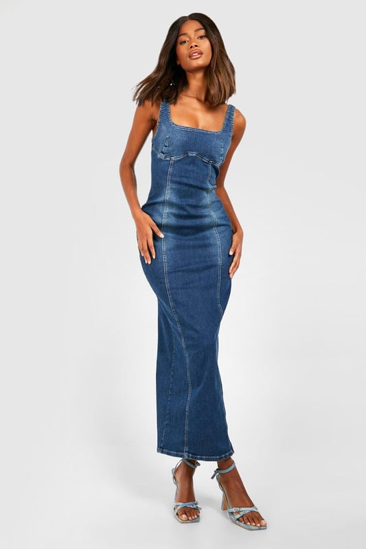 Stretch Denim Seam Detail Maxi Dress Figure-hugging maxi dress with stretch denim fabric
Distinctive seam detailing for added visual interest
Square neckline and thick straps for a flattering silhouette
Side slit for ease of movement and a touch of allure
Versatile design suitable for various casual occasions
Make a statement in this striking stretch denim maxi dress that combines comfort with style. The form-fitting silhouette accentuates your curves while the seam detailing adds a unique touch to the classic denim look. Perfect for those who want to stand out at casual events, this dress can be easily dressed up or down. Pair it with strappy heels and statement earrings for a chic daytime look, or throw on a denim jacket and trainers for a more relaxed vibe. The side slit offers both practicality and a hint of glamour, making it ideal for summer barbecues, casual dates, or weekend brunches with friends. This Boohoo dress embodies the brand's ethos of trendy, inclusive fashion that doesn't compromise on style or comfort, making it a must-have addition to any fashion-forward wardrobe.