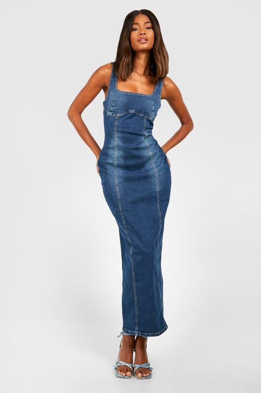 Stretch Denim Seam Detail Maxi Dress Figure-hugging maxi dress with stretch denim fabric
Distinctive seam detailing for added visual interest
Square neckline and thick straps for a flattering silhouette
Side slit for ease of movement and a touch of allure
Versatile design suitable for various casual occasions
Make a statement in this striking stretch denim maxi dress that combines comfort with style. The form-fitting silhouette accentuates your curves while the seam detailing adds a unique touch to the classic denim look. Perfect for those who want to stand out at casual events, this dress can be easily dressed up or down. Pair it with strappy heels and statement earrings for a chic daytime look, or throw on a denim jacket and trainers for a more relaxed vibe. The side slit offers both practicality and a hint of glamour, making it ideal for summer barbecues, casual dates, or weekend brunches with friends. This Boohoo dress embodies the brand's ethos of trendy, inclusive fashion that doesn't compromise on style or comfort, making it a must-have addition to any fashion-forward wardrobe.