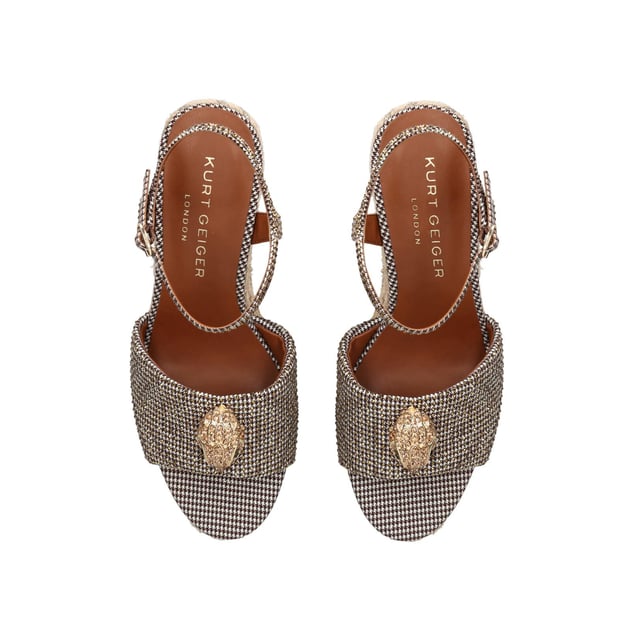 The Kensington Espadrille, an addition to the iconic Kensington collection, is crafted in a brown houndstooth embellished with gold crystals. The rope wedge heel features gold thread running through the heel. Heel height: 10.5cm.