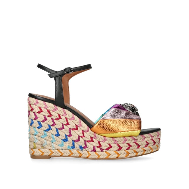 The Kensington Espadrille, an addition to the iconic Kensington collection, is crafted in a pebble grain cow leather in the iconic rainbow sewn stripe pattern. The rope wedge heel features rainbow thread running through the heel. Heel height: 10.5cm.