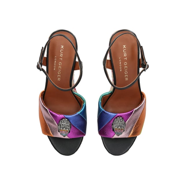 The Kensington Espadrille, an addition to the iconic Kensington collection, is crafted in a pebble grain cow leather in the iconic rainbow sewn stripe pattern. The rope wedge heel features rainbow thread running through the heel. Heel height: 10.5cm.