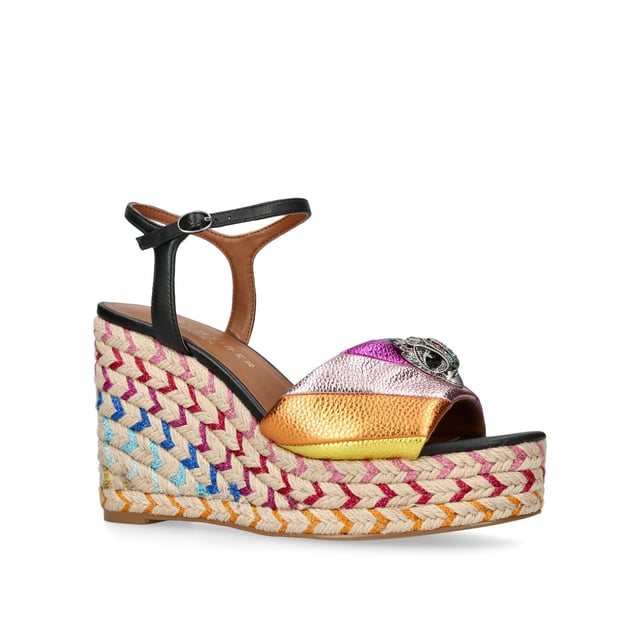 The Kensington Espadrille, an addition to the iconic Kensington collection, is crafted in a pebble grain cow leather in the iconic rainbow sewn stripe pattern. The rope wedge heel features rainbow thread running through the heel. Heel height: 10.5cm.