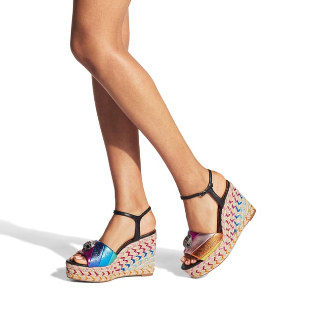 The Kensington Espadrille, an addition to the iconic Kensington collection, is crafted in a pebble grain cow leather in the iconic rainbow sewn stripe pattern. The rope wedge heel features rainbow thread running through the heel. Heel height: 10.5cm.