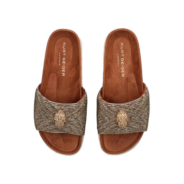 The Kensington Flatform, an addition to the Kensington Collection, features a houndstooth strap embellished with gold crystals. The gold Eagle head features crystals and black crystal eyes on the strap. Sole height: 4cm.
