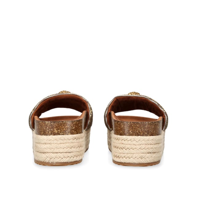 The Kensington Flatform, an addition to the Kensington Collection, features a houndstooth strap embellished with gold crystals. The gold Eagle head features crystals and black crystal eyes on the strap. Sole height: 4cm.
