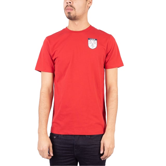 100% Katoen. Stof: Zachte aanraking. Ontwerp: Badge, gedrukt. Halslijn: Crew Neck, Ribbed. Mouwtype: Korte mouwen. Getapete details. M: 40 in. L: 42 in.