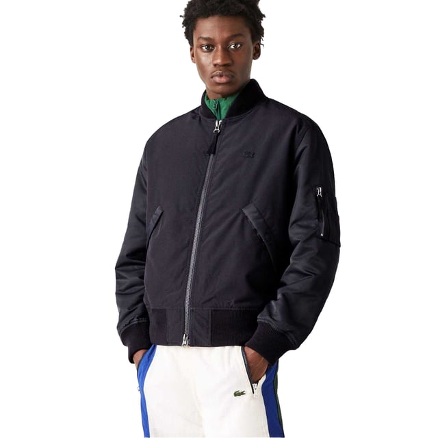 84% Polyester, 16% Katoen. Voering: Contrast. Ontwerp: Logo, eenvoudig. Mouwtype: Met lange mouwen. Halslijn: Ribbel, Staande Kraag. Manchet: Ribbel. Zakken: 2 zijzakken, 2 borstzakken, intern, drukknoopsluiting, 1 mouwzak, ritssluiting. Bevestiging: Volledige ritssluiting. Hem: Ribben. M: 40 in. M-L: 44 in. L-XL: 48 in.