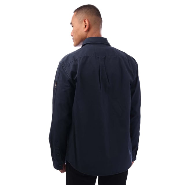 Point collar.Long sleeve.Centre front button fastening.Signature tilted flap pocket.Adjustable buttoned cuff.Belstaff Phoenix patch on sleeve.Garment-dyed cotton twill.