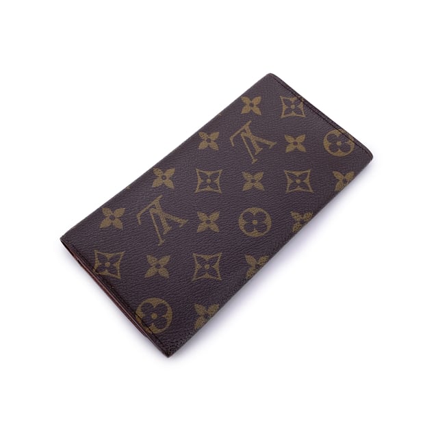 VINTAGE, RRP AS NEW
Step into timeless elegance with this vintage Louis Vuitton long bifold bill wallet, crafted from the Maison's signature brown monogram canvas. A classic piece that reflects the golden era of Louis Vuitton craftsmanship, this wallet exudes understated luxury with every detail.  Designed with a flap closure, the wallet opens to reveal a smooth leather lining, featuring one main compartment for bills, 3 smaller side open pockets and a convenient open pocket under the flap-perfect for receipts or essentials. Inside, you'll find the unmistakable 'LOUIS VUITTON Paris - Made in Spain' stamp, alongside the ity serial number (CA0938), confirming its heritage.  A refined yet practical piece, this vintage wallet carries not just currency, but the spirit of travel, history, and French savoir-faire. Ideal for collectors or lovers of classic luxury. Condition Rating: B - VERY GOOD CONDITIONCondition Details: Gently used. Some scratches on the internal lining. Please check the photos carefully and ask if you need to know more details or if you have any doubts.Measurements (cm): Height: 10.2Length: 17.8Box?: No Measurments:  length: 178 mm height: 102 mm strap length: 0 mm handle drop: 0 mm