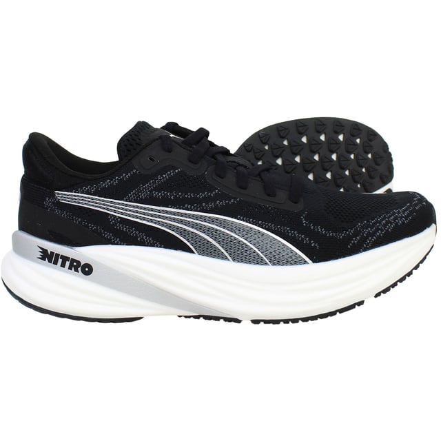 Puma Magnify Nitro 2 Womens Black Running Shoes The PUMA Magnify NITRO 2 Women’s Black is a high-stack, max‑cushioned trainer crafted for daily miles and long-distance comfort. Featuring full-length NITRO foam and a grippy outsole, these shoes deliver soft, responsive cushioning with standout traction and durability. With its sleek black colorway, engineered knit upper, and supportive feel, this edition offers both performance and everyday style.
Key Features
Full-Length NITROFOAM™ Midsole
Puma’s nitrogen-infused foam delivers plush yet responsive cushioning across the entire footbed—perfect for base miles and recovery runs.
Engineered Knit Upper with PWRTAPE Reinforcements
Premium knit fabric molds to the foot for comfort and breathability, while strategic overlay tape adds structural support and a secure fit.
PUMAGRIP Rubber Outsole with Targeted Coverage
Durable traction zones at key contact areas ensure reliable grip and stability on roads—even in damp conditions.
Generous Stack Height with Smooth Transition
Approximately 40 mm heel, 30 mm forefoot, and a 10 mm drop deliver an elevated, rocker-like gait without stiffness.
Moulded Heel Collar and Padded Tongue
Enhances rear-foot comfort and lockdown, reducing heel slippage and irritation on longer runs.