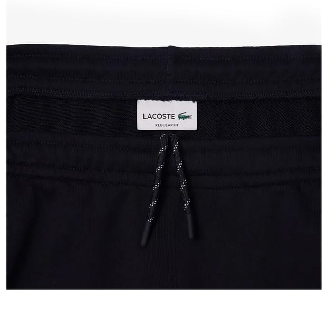 Bio-Baumwolle. Gewebe: Fleece, Beflockt. Design: Logo, Mit Streifendetail. Zum Überziehen. Taschenart: Zwei Seitentaschen. Taille: mit Kordelzug. Passform: Regulär.
