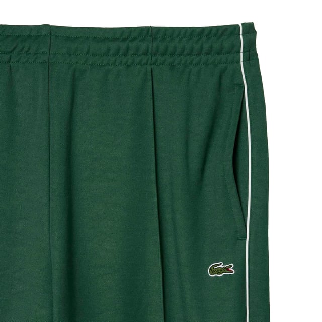 51% Recyceltes Polyester, 49% Bio-Baumwolle. Gewebe: Verriegelung, Piqué. Design: Kontrast-Besatz, Logo. Gewebetechnik: Strapazierfähig. Taschenart: Zwei Seitentaschen, 1 Tasche hinten, Reißverschluss. Passform: Gerade abgeschnitten.