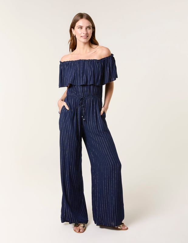 A light, breezy jumpsuit to wear this summer. Team with white trainers and a denim jacket for the perfect everyday look.     