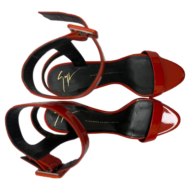 VINTAGE, RRP AS NEW
The Giuseppe Zanotti High Ankle Strap Sandal Heels in red patent leather are a show-stopping fusion of bold color and architectural elegance. With a sculptural stiletto heel, glossy finish, and high ankle strap, they command attention and elevate any ensemble. **Style Tip:** Keep the rest of your look sleek and simple—think a little black dress or fitted monochrome jumpsuit—to let these fiery heels take center stage.

 Giuseppe Zanotti High Ankle Strap Sandal Heels in Red Patent Leather

Condition: Excellent
Signs of wear: No visible signs of wear
Packaging: Box, Dust bag
Color: Red 
Material: Leather | patent leather
Size: IT | 37.5
Measurements: Heel height: 100 mm; Insole length: 270 mm
SKU: TONPUGBSH509156W