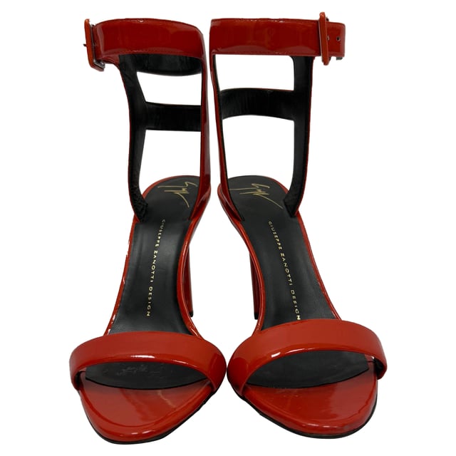 VINTAGE, RRP AS NEW
The Giuseppe Zanotti High Ankle Strap Sandal Heels in red patent leather are a show-stopping fusion of bold color and architectural elegance. With a sculptural stiletto heel, glossy finish, and high ankle strap, they command attention and elevate any ensemble. **Style Tip:** Keep the rest of your look sleek and simple—think a little black dress or fitted monochrome jumpsuit—to let these fiery heels take center stage.

 Giuseppe Zanotti High Ankle Strap Sandal Heels in Red Patent Leather

Condition: Excellent
Signs of wear: No visible signs of wear
Packaging: Box, Dust bag
Color: Red 
Material: Leather | patent leather
Size: IT | 37.5
Measurements: Heel height: 100 mm; Insole length: 270 mm
SKU: TONPUGBSH509156W