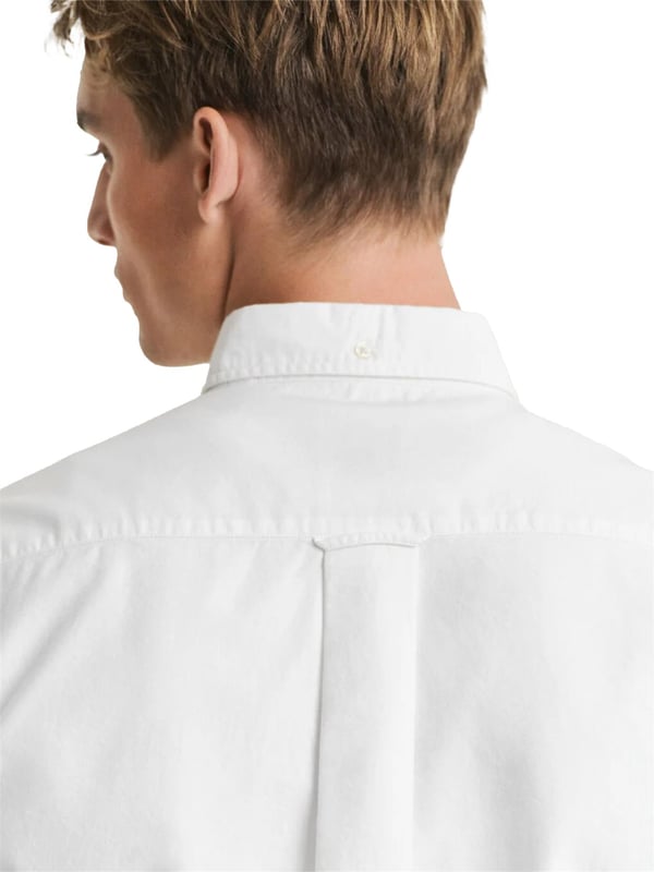 Timeless and versatile, the Classic Oxford Shirt is a smart-casual essential crafted from durable cotton. Designed in a regular fit with short sleeves, it’s perfect for the warmer months. Details include a button-down collar, curved hem, chest pocket with shield embroidery, and a box pleat with locker loop at the back for added comfort and style.