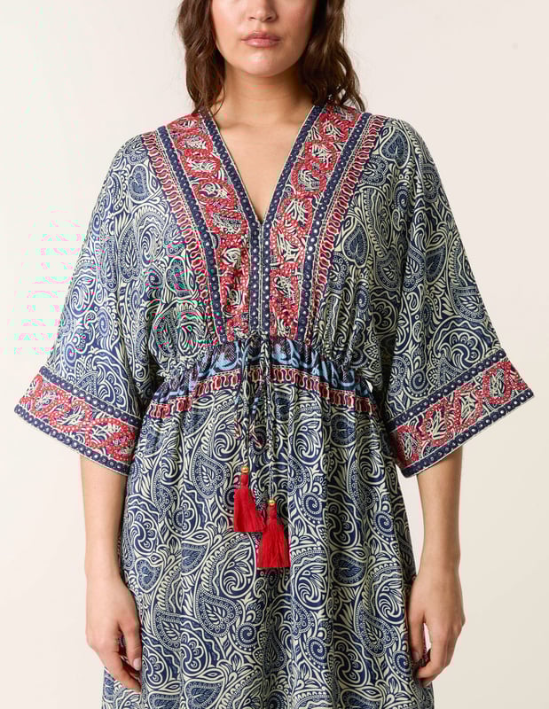 A kimono style maxi dress perfect to pack for your next summer holiday. Tassels, embellishment and abstract prints this dress really does have it all!     